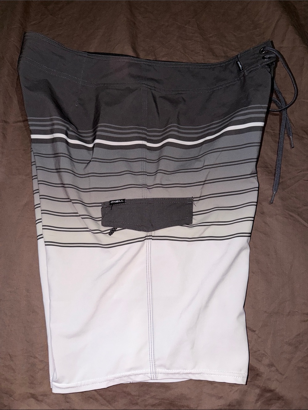 O’Neill gray & white swim trunks Men’s size 34 side pocket